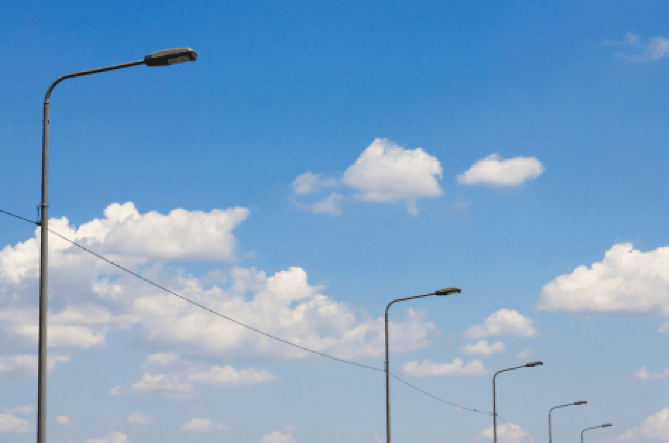 LED Street lights lined going down a road